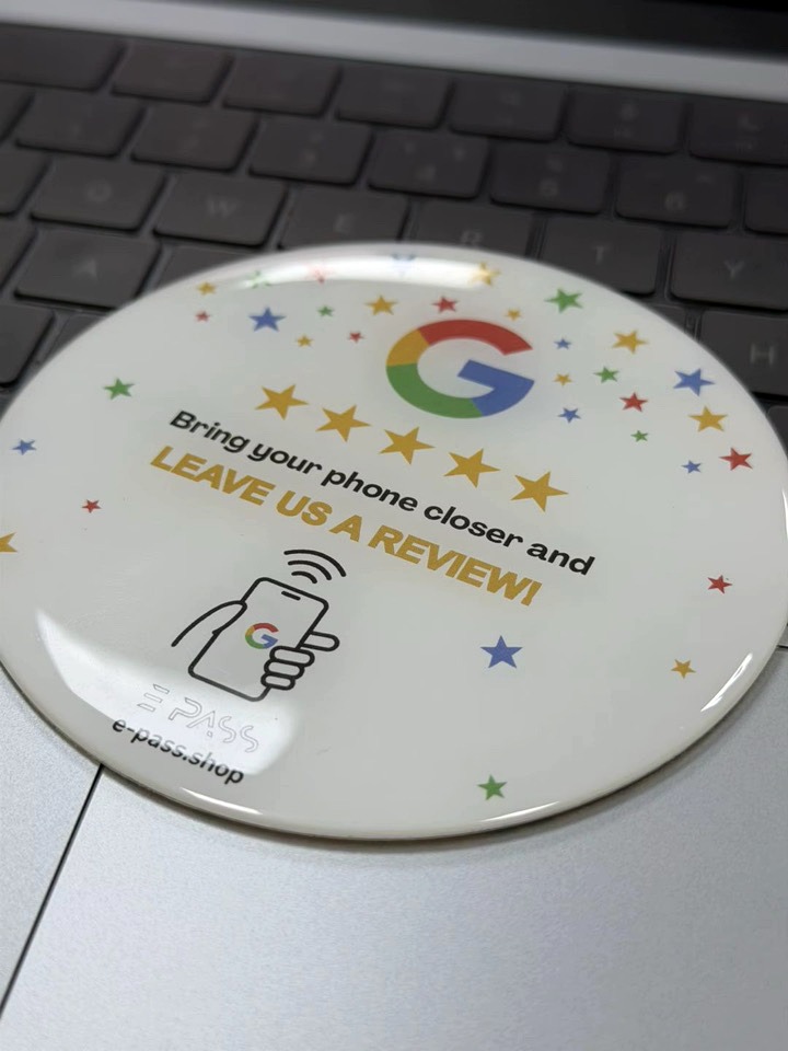 Branded NFC review disc used on a counter